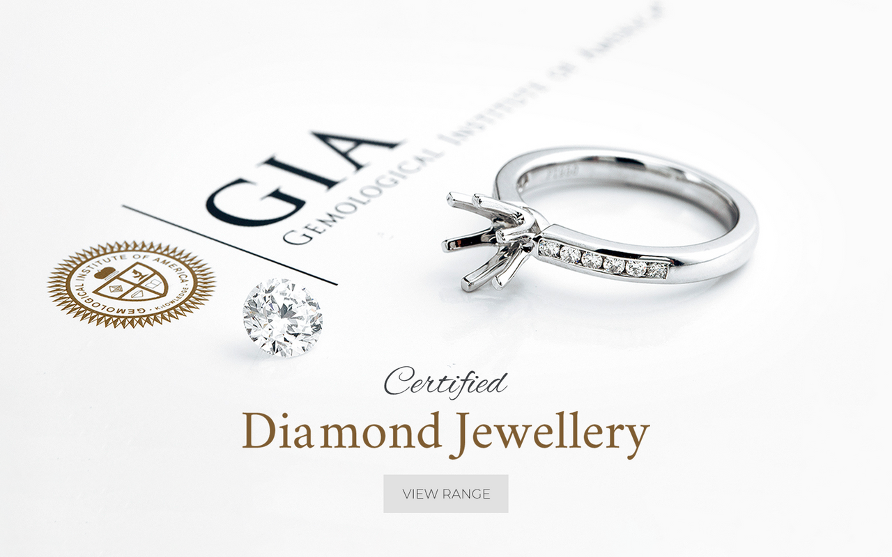 GIA diamond and ring set atop a GIA certification document